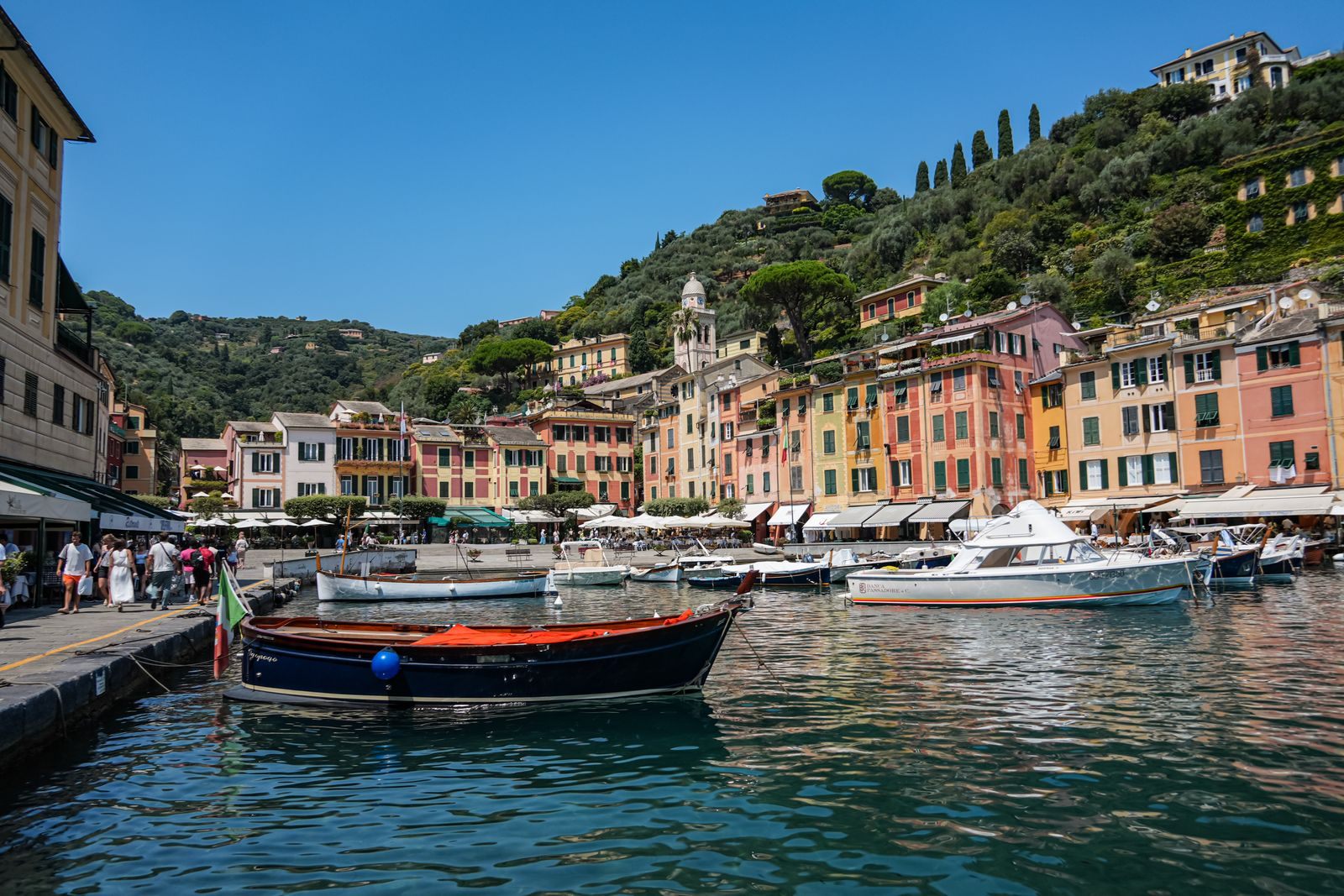 Colorful harbor of Portofino with boats on a sunny day